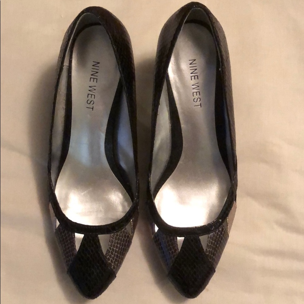 Black, gray, silver patent leather dress shoes.